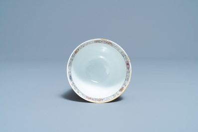 A Chinese famille rose 'romantic subject' cup and saucer, Yongzheng/Qianlong