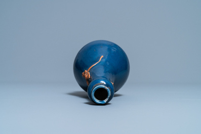 Un vase en porcelaine de Chine en bleu monochrome figurant un dragon appliqu&eacute; en biscuit, Jiajing