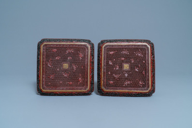 A pair of Chinese black and red cinnabar lacquer square dishes, Qianlong mark and of the period