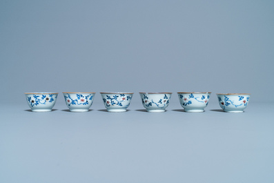 Six Chinese blue, white and copper red cups and saucers, Kangxi