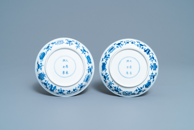 A pair of Chinese blue and white plates with taoist symbols, Kangxi mark and of the period