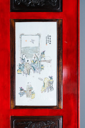 A Chinese qianjiang cai plaque mounted in a wooden table, 19/20th C.