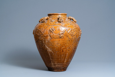 A large Chinese brown-glazed relief-molded martaban jar with Buddhist lions, Ming