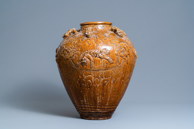 A large Chinese brown-glazed relief-molded martaban jar with Buddhist lions, Ming