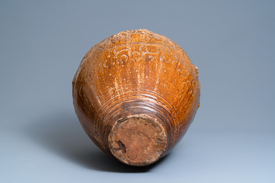 A large Chinese brown-glazed relief-molded martaban jar with Buddhist lions, Ming