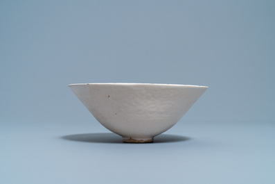 A Chinese luanbai bowl with molded design of characters and floral sprigs, Yuan