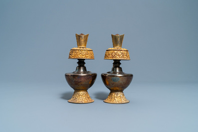 A pair of Tibetan silver and gilt copper alloy 'duomuhu' ewers, 19th C.