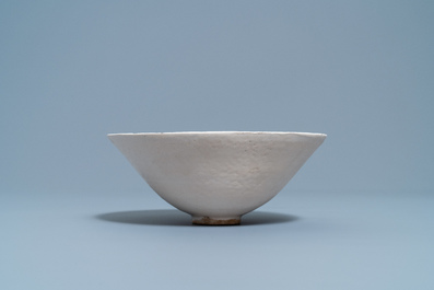 A Chinese luanbai bowl with molded design of characters and floral sprigs, Yuan