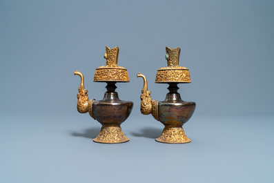 A pair of Tibetan silver and gilt copper alloy 'duomuhu' ewers, 19th C.