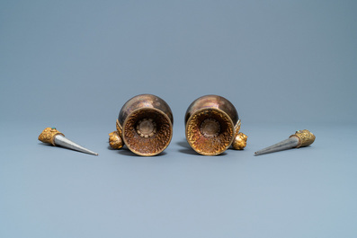 A pair of Tibetan silver and gilt copper alloy 'duomuhu' ewers, 19th C.