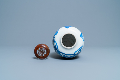 Een Chinese blauw-witte, koperrode en celadon vaas met landschapsdecor, Kangxi