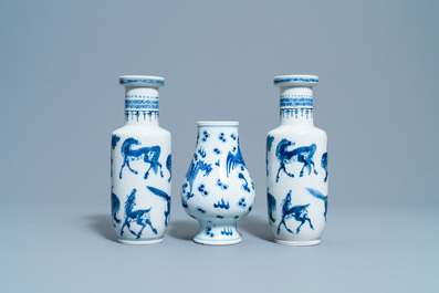 A pair of Chinese blue and white 'mythical beasts' vases and a pear-shaped 'dragon and phoenix' vase, 19th C.