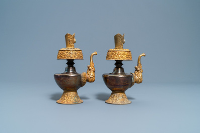 A pair of Tibetan silver and gilt copper alloy 'duomuhu' ewers, 19th C.