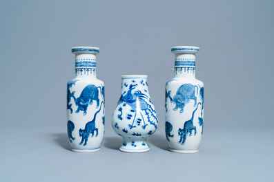 A pair of Chinese blue and white 'mythical beasts' vases and a pear-shaped 'dragon and phoenix' vase, 19th C.