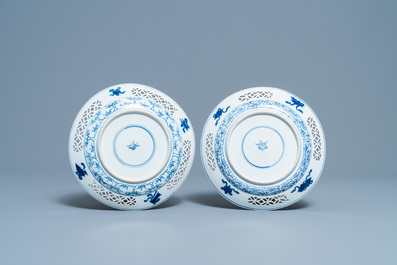 A pair of Chinese blue and white 'reticulated border' plates, Kangxi