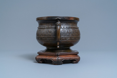 A large Chinese bronze 'Gui' vessel on hardwood stand, Yuan