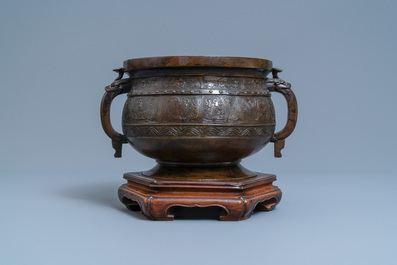 A large Chinese bronze 'Gui' vessel on hardwood stand, Yuan