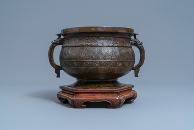 A large Chinese bronze 'Gui' vessel on hardwood stand, Yuan