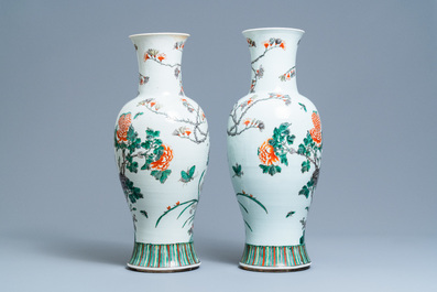 A pair of Chinese famille verte vases with birds among blossoming branches, 19th C.