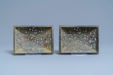 A pair of Chinese Ming-style bronze censers with reticulated covers, 19th C.