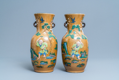 A pair of Chinese famille rose relief-molded vases and two with phoenixes, 19th C.