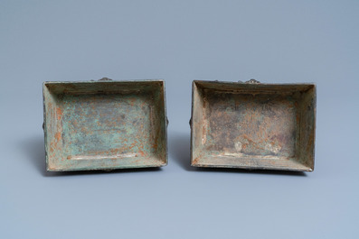 A pair of Chinese Ming-style bronze censers with reticulated covers, 19th C.