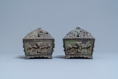 A pair of Chinese Ming-style bronze censers with reticulated covers, 19th C.