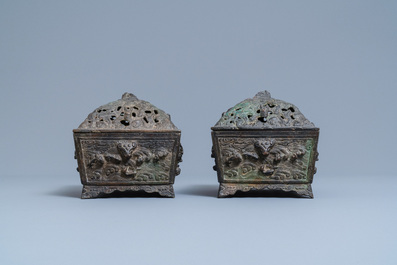 A pair of Chinese Ming-style bronze censers with reticulated covers, 19th C.