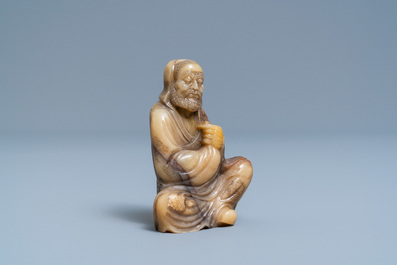 A Chinese Shoushan soapstone figure of a bearded elder, 18th C.