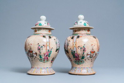A pair of Chinese Nanking famille rose crackle-glazed 'court scene' vases, 19th C.