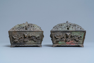 A pair of Chinese Ming-style bronze censers with reticulated covers, 19th C.