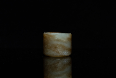 A Chinese mottled celadon jade archer's ring, Ming