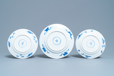Eight Chinese blue and white plates with birds among blossoms, Kangxi