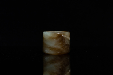 A Chinese mottled celadon jade archer's ring, Ming