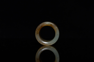 A Chinese mottled celadon jade archer's ring, Ming