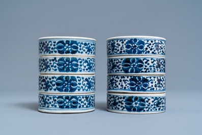 A pair of Chinese blue and white four-tier stacking boxes, a seal paste box and four saucers, 19th C.