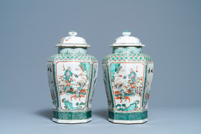 A pair of Chinese octagonal famille verte vases and covers, 19th C.