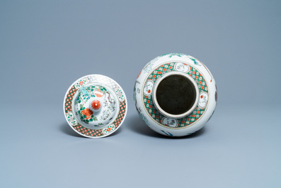 A Chinese famille verte vase and cover, Kangxi mark, 19th C.