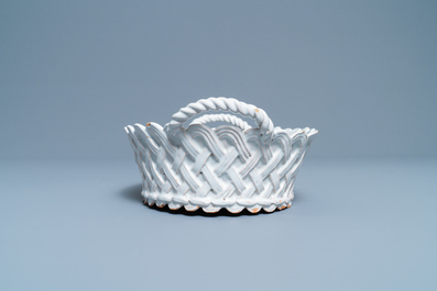 A white Delftware basket, a lobed dish, a spice box and a sauce boat, 18th C.