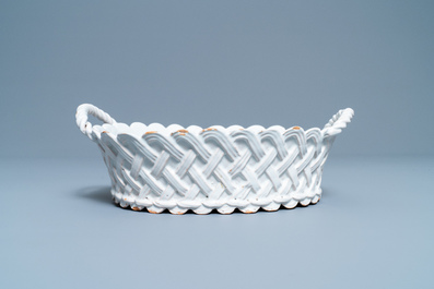 A white Delftware basket, a lobed dish, a spice box and a sauce boat, 18th C.