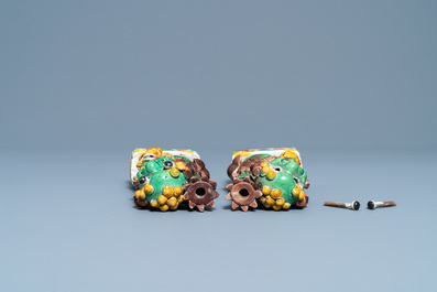 A pair of Chinese sancai-glazed biscuit Buddhist lion joss stick holders, Kangxi