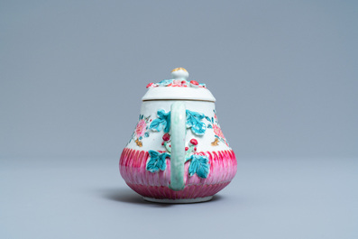 A Chinese famille rose teapot on stand with applied floral design, Yongzheng