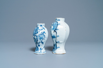 A varied collection of blue and white Dutch Delft plates and vases, 18th C.