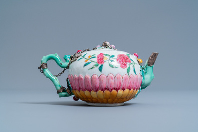 A Chinese famille rose teapot on stand with applied floral design, Yongzheng