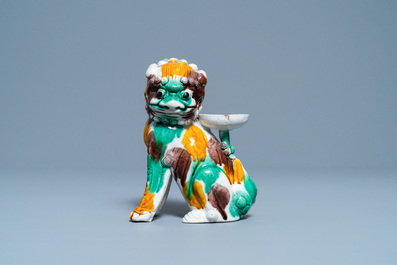 A Chinese sancai-glazed biscuit Buddhist lion joss stick holder, Kangxi