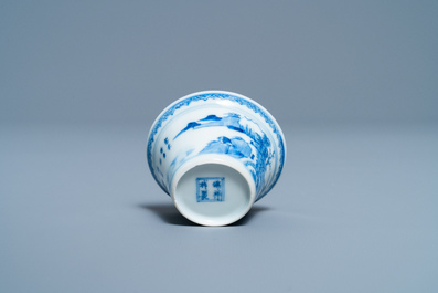 A Chinese blue and white inscribed wine cup, Kangxi