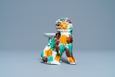 A Chinese sancai-glazed biscuit Buddhist lion joss stick holder, Kangxi