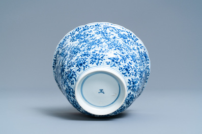 A Chinese blue and white molded bowl with floral design, Kangxi