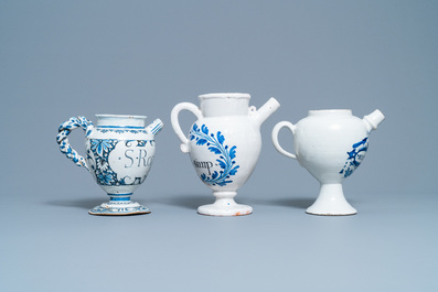 Three blue and white Dutch Delft, Nevers and Rouen wet drug jars and four jugs, 17/18th C.