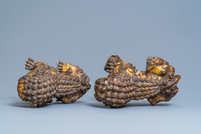 A pair of large Chinese gilt-lacquered iron models of Buddhist lions, 18/19th C.